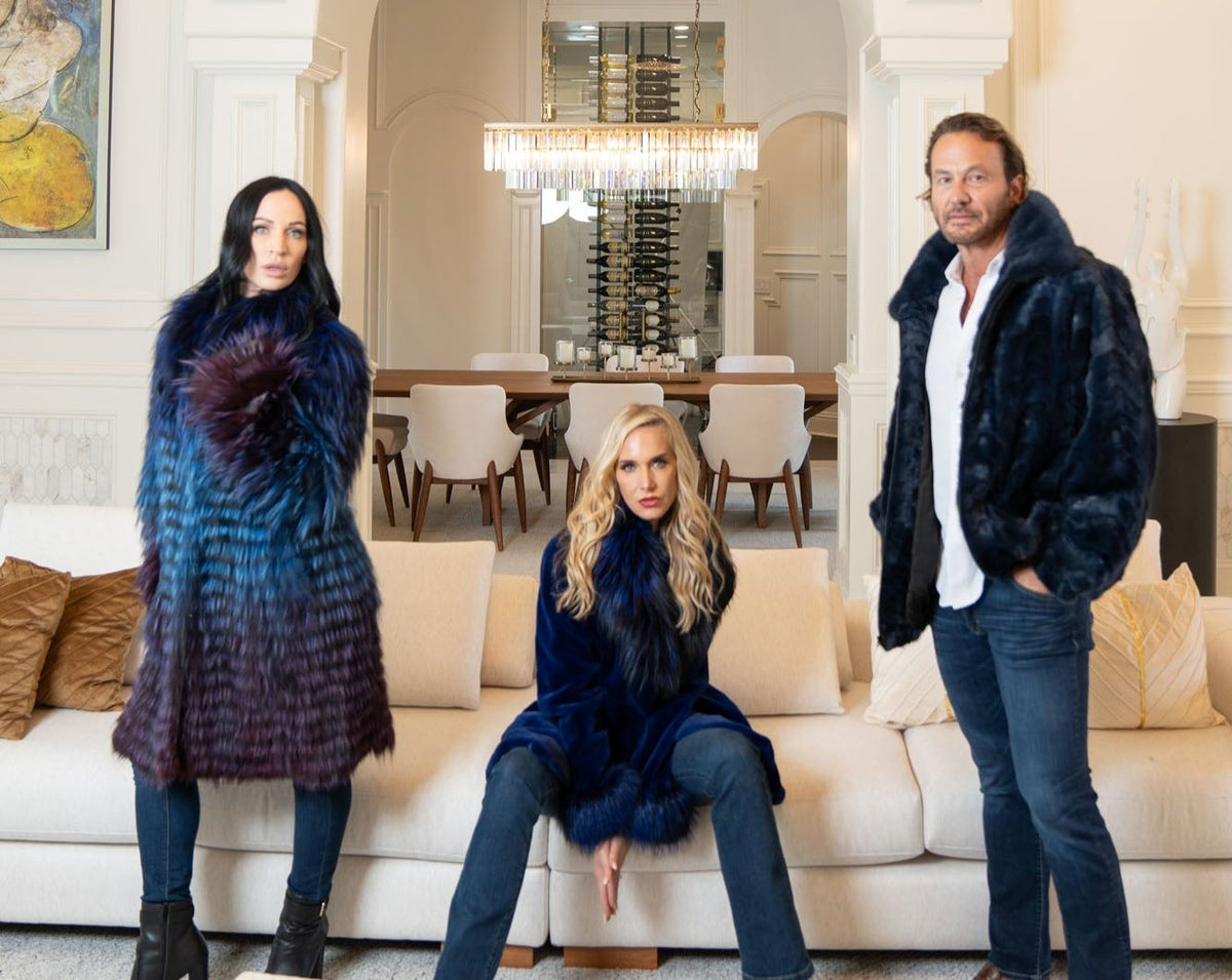Models wearing fur outerwear in an indoor fashion shoot